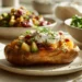 Baked potato bar with cheese, sour cream, veggies, and bacon – a quick customizable 30-minute meal.
