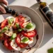 Caprese salad with tomatoes, mozzarella, basil, and balsamic glaze – a quick 30-minute healthy meal.