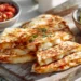 Cheesy quesadillas with salsa and guacamole – a quick and easy 30-minute Mexican-inspired meal.