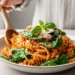 Creamy tomato pasta with spinach in white bowl - 30 minute healthy dinner recipe