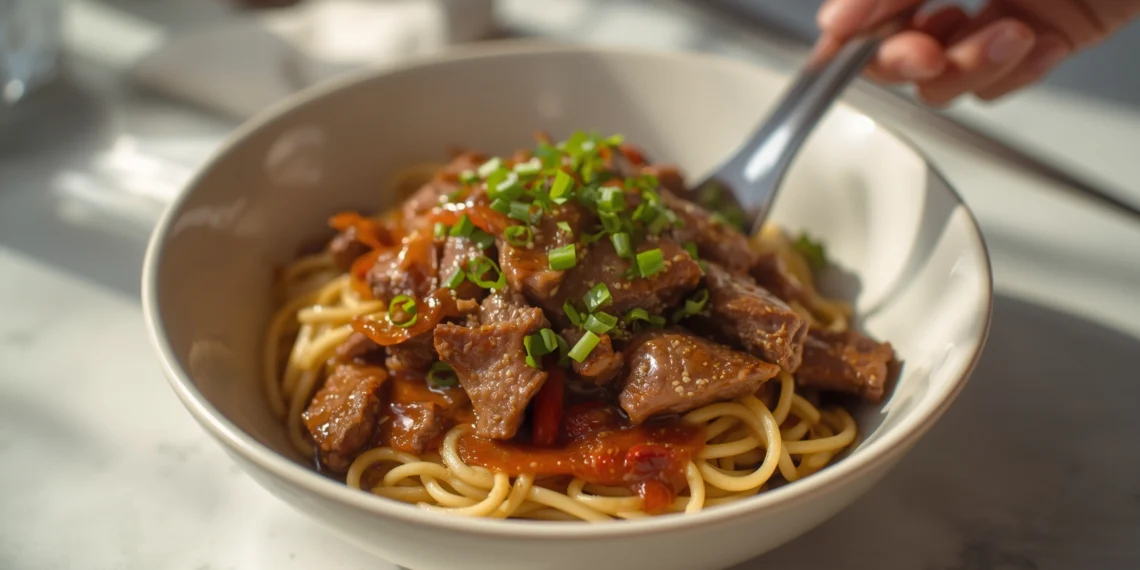 Beef stir-fry with noodles, bell peppers, and broccoli – a flavorful 30-minute Asian-inspired dinner.