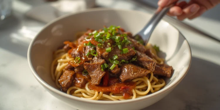 Beef stir-fry with noodles, bell peppers, and broccoli – a flavorful 30-minute Asian-inspired dinner.