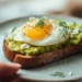 Easy avocado toast with fried egg on whole wheat bread, ready in 5 minutes for busy family breakfast