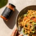 Vegan spicy peanut noodles with colorful vegetables – a quick and healthy 30-minute meal.
