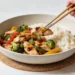 One-pan chicken stir-fry with colorful vegetables, glossy sauce, and Asian-inspired flavors.