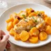 One-pan chicken and sweet potato bake with roasted vegetables, golden and wholesome in a skillet.