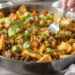 One-pan taco bake with seasoned meat, tortillas, and melted cheese, colorful and family-friendly.