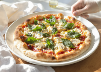 Quick vegetarian pizza using store-bought dough, topped with vegetables and melted cheese.