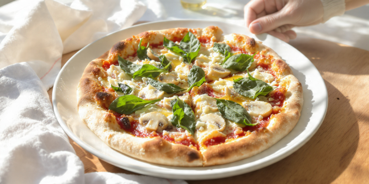 Quick vegetarian pizza using store-bought dough, topped with vegetables and melted cheese.