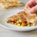 Vegetarian quesadillas with five different fillings, golden and crispy, served hot from the pan.