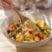 Vegetarian stir-fry with tofu, colorful vegetables, and peanut sauce, quick and easy to prepare.