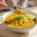 Budget-friendly chickpea curry bowl with rice and naan bread