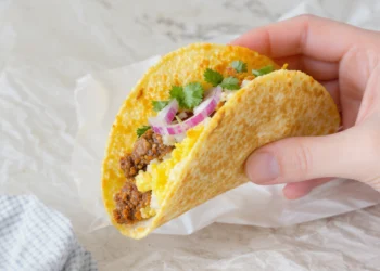 Quick breakfast tacos with scrambled eggs, cheese, and avocado