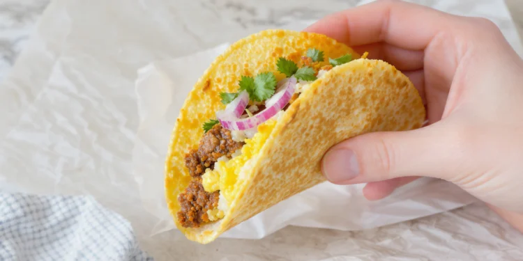 Quick breakfast tacos with scrambled eggs, cheese, and avocado