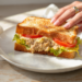 Budget tuna melt sandwich with melted cheese, canned tuna, and toasted bread for quick easy meals