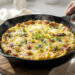 Budget-friendly frittata with eggs, vegetables, and simple ingredients cooked as a quick, affordable meal.