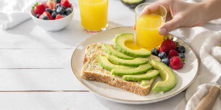 Quick healthy breakfast with high-fiber foods including oatmeal, berries, whole grain toast, and chia seeds