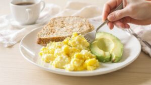 Easy to chew breakfast for seniors with oatmeal, eggs, yogurt, and soft fruits