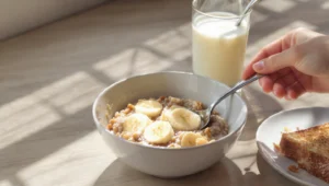 Healthy breakfast under 300 calories with poached egg, berries, yogurt and avocado on white plate