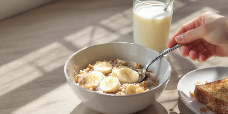 Healthy breakfast under 300 calories with poached egg, berries, yogurt and avocado on white plate