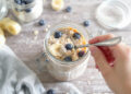 Quick healthy overnight oats with berries and banana in glass jar