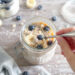 Quick healthy overnight oats with berries and banana in glass jar
