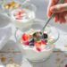 Healthy yogurt parfait breakfast with berries, granola and honey - quick morning meal