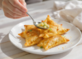 Potato and pea samosas, quick vegetarian pastries with a golden, crispy shell.