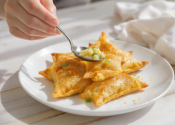 Potato and pea samosas, quick vegetarian pastries with a golden, crispy shell.