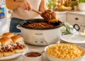 Summer crockpot family meal with fresh vegetables and herbs in a slow cooker